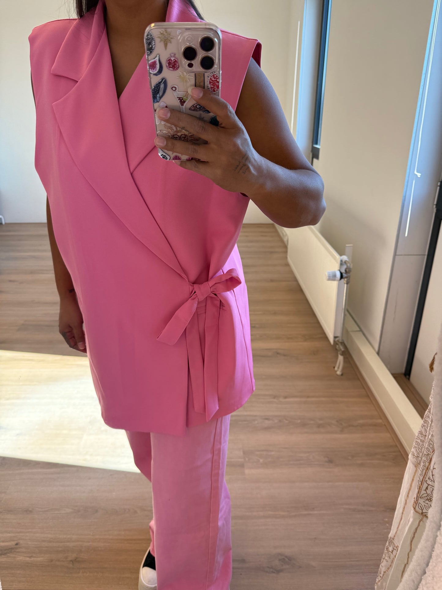 Charlotte bow gilet pink